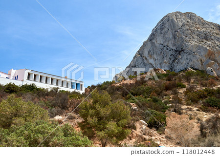 Majestic Mountain Landscape: Scenic View of Sky and Cozy House on Mountain Peak with Panoramic Horizon. Tranquil Mountain Retreat: Breathtaking View of Sky and Idyllic House Nestled on Rugged Mountain Majestic Mountain Landscape: Scenic View of Sky and Cozy House on Mountain Peak with Panoramic Horizon. Tranquil Mountain Retreat: Breathtaking View of Sky and Idyllic House Nestled on Rugged Mountain 118012448