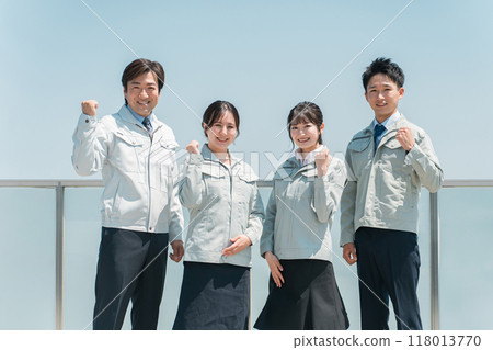 Male and female staff in the manufacturing, building, transportation, and construction industries wearing work clothes. Male and female staff in the manufacturing, building, transportation, and construction industries wearing work clothes. 118013770