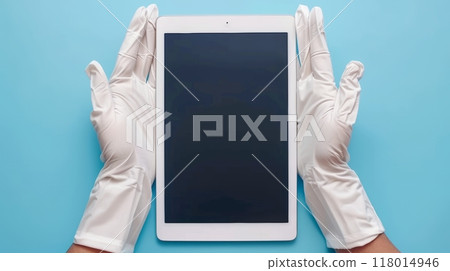 White-Gloved Hands Gently Holding a Tablet, Display Facing Viewer on a Blue Background 118014946