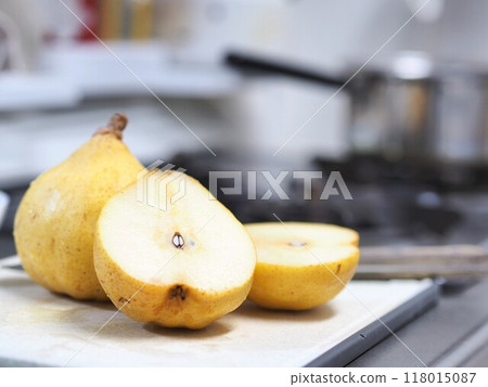 Pear being cut in the kitchen (Le Lectier) Pear being cut in the kitchen (Le Lectier) 118015087