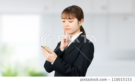 Young business woman with smartphone Young business woman with smartphone 118015153