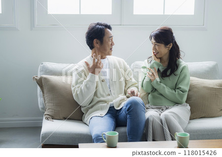 A shocking thing happened to a middle-aged couple in the living room. 118015426