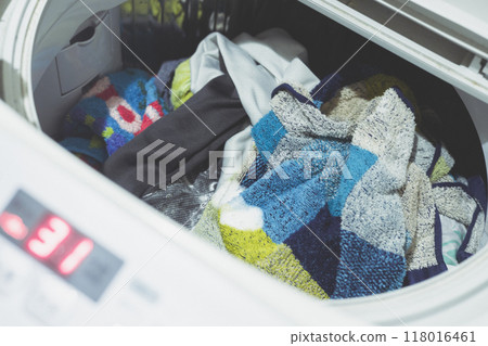 Inside a washing machine belonging to a man living alone Inside a washing machine belonging to a man living alone 118016461