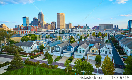 Aerial Suburban Homes and City Skyline at Golden Hour 118016769