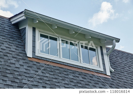 Modern Dormer Window with Gutter System on Residential Home Modern Dormer Window with Gutter System on Residential Home 118016814
