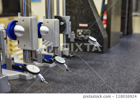 Precision Measurement Tools on Granite Surface in Industrial Setting Precision Measurement Tools on Granite Surface in Industrial Setting 118016924