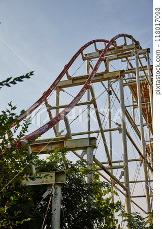 Abandoned Rusty Roller Coaster with Creeping Foliage, Ground-Up View Abandoned Rusty Roller Coaster with Creeping Foliage, Ground-Up View 118017098