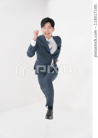 A businessman in a dashing pose A businessman in a dashing pose 118017100