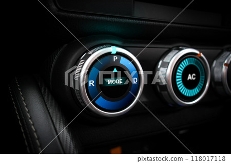 A rotary gear shift dial on the dashboard of an EV car or electric vehicle , P Parking 118017118