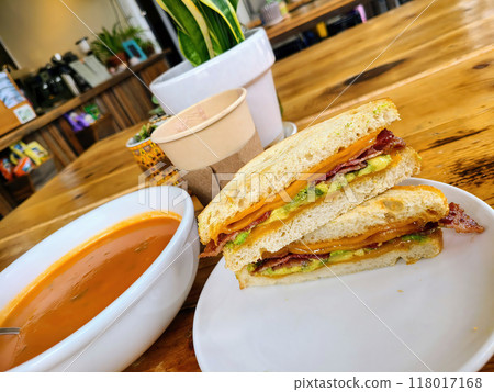 Cozy Cafe Bacon Avocado Cheese Sandwich with Tomato Soup Cozy Cafe Bacon Avocado Cheese Sandwich with Tomato Soup 118017168