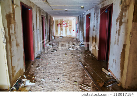 Abandoned Hotel Corridor with Graffiti and Debris, Urbex Mood 118017194
