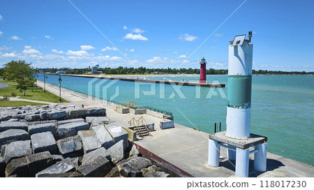 Aerial View of Red Lighthouse and Pier on Sunny Day 118017230