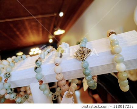 Handcrafted Beaded Bracelets Detail Close-Up in Warm Boutique Lighting 118017232