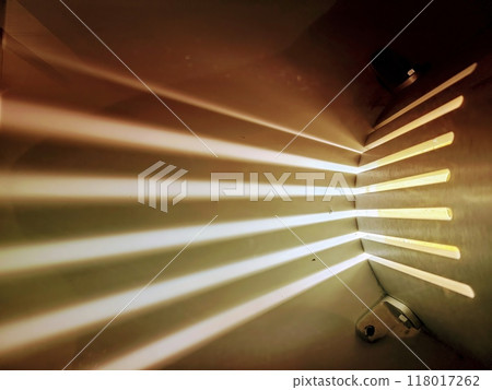 Sunlight Beams Through Industrial Slats Low Perspective 118017262