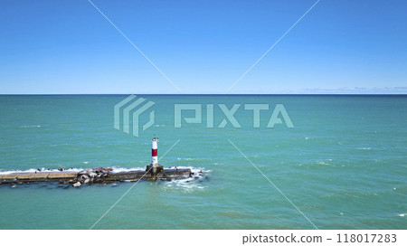 Aerial View of Lighthouse on Pier in Turquoise Waters of Lake Michigan Aerial View of Lighthouse on Pier in Turquoise Waters of Lake Michigan 118017283