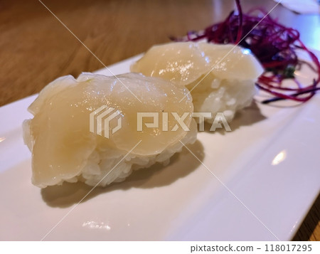 Scallop Sushi on White Plate Eye-Level Close-Up Scallop Sushi on White Plate Eye-Level Close-Up 118017295