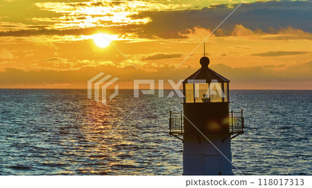 Aerial View of Lighthouse at Sunset Over Lake Michigan Aerial View of Lighthouse at Sunset Over Lake Michigan 118017313