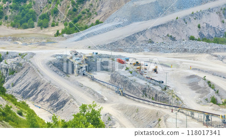Aerial View of Expansive Quarry with Heavy Machinery and Dirt Roads 118017341