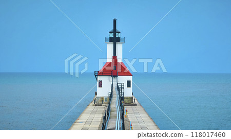 Aerial View of Red-Roofed Lighthouse on Pier Extending into Lake Michigan 118017460