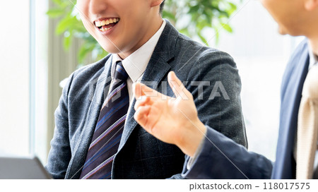 Two male businessmen having a meeting 118017575