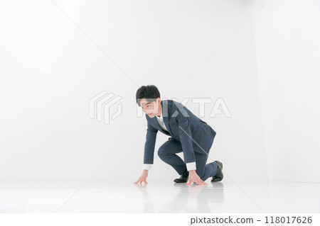 Salaryman doing a crouching start pose Salaryman doing a crouching start pose 118017626