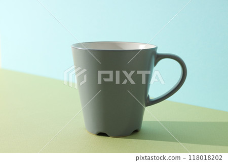 A beautiful dark cup on a light background A beautiful dark cup on a light background 118018202