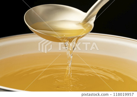 Dashi soup: Scoop out the dashi soup with a ladle Dashi soup: Scoop out the dashi soup with a ladle 118019957