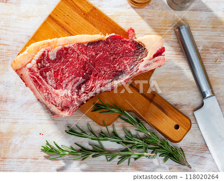 Ingredients for cooking. Fresh raw beef entrecote on wooden cutting board Ingredients for cooking. Fresh raw beef entrecote on wooden cutting board 118020264