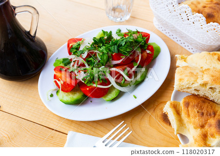 Salad with fresh tomatoes, cucumbers, onion and coriander 118020317