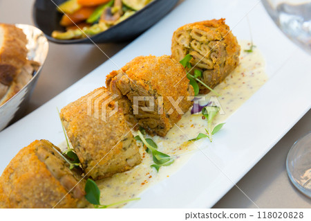 Pan-fried pieces of Andouillette Pan-fried pieces of Andouillette 118020828