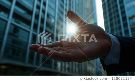Palms and light of a businessman standing in a city street 118021134