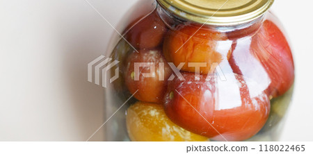 spoiled can of vegetable seaming. Glass jar with pickled tomatos and cucumbers 118022465