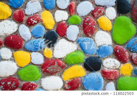 Multicolored stones. The wall is painted in different colors in texture style. Multicolored stones. The wall is painted in different colors in texture style. 118022503