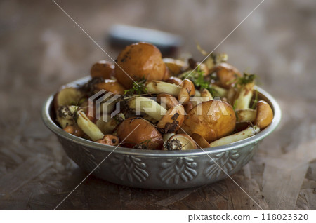 Fresh mushrooms slippery jack (Suillus luteus) in a metal bowl on a rustic background. 118023320