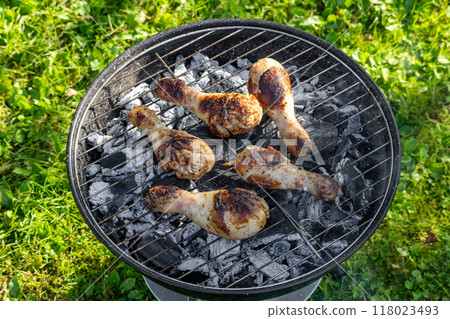 chicken legs on a grill chicken legs on a grill 118023493