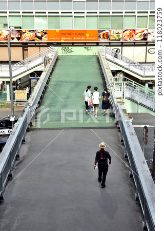 People crossing the Miyashita pedestrian bridge in Shibuya 118023759