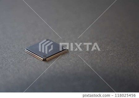 Close-up of a semiconductor IC on a black background Close-up of a semiconductor IC on a black background 118025456