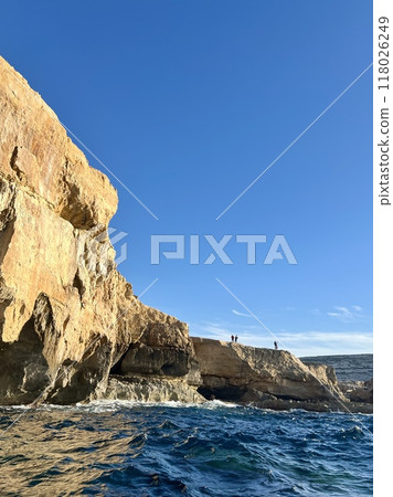 Rocky coast at Xlendi Bay of the island of Gozo, Malta, Europe 118026249