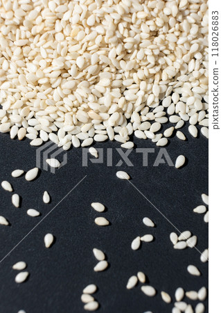 Macro kernels of white roasted sesame seeds. Macro kernels of white roasted sesame seeds. 118026883