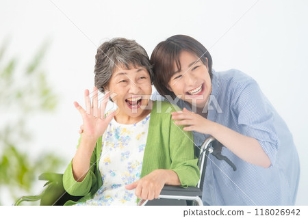 Grandma and grandson in wheelchair Grandma and grandson in wheelchair 118026942