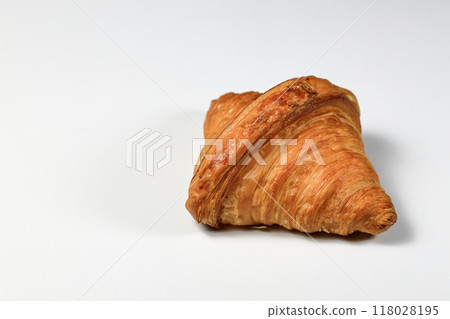 Freshly baked croissant, Brown crispy croissants isolated on white background. French pastry closeup photo. Buttered bread croissant. Freshly baked croissant, Brown crispy croissants isolated on white background. French pastry closeup photo. Buttered bread croissant. 118028195