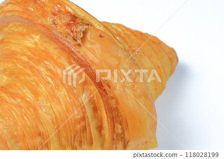 Freshly baked croissant, Brown crispy croissants isolated on white background. French pastry closeup photo. Buttered bread croissant. Freshly baked croissant, Brown crispy croissants isolated on white background. French pastry closeup photo. Buttered bread croissant. 118028199