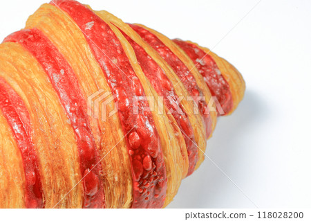 Close up Freshly baked croissant, Double Rasberry croissant isolated on white background. French pastry closeup photo. Buttered bread croissant. Close up Freshly baked croissant, Double Rasberry croissant isolated on white background. French pastry closeup photo. Buttered bread croissant. 118028200
