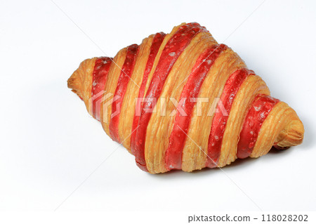 Freshly baked croissant, Double Rasberry croissant isolated on white background. French pastry closeup photo. Buttered bread croissant. 118028202