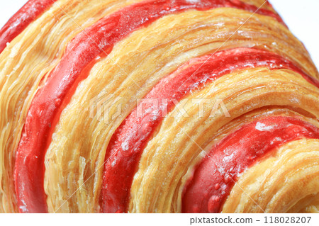 Close up Freshly baked croissant, Double Rasberry croissant isolated on white background. French pastry closeup photo. Buttered bread croissant. 118028207