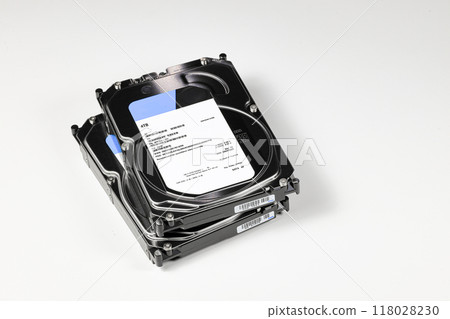 pile or stack of Hight capacity HDD, hard disk drives 3.5" standard profile show on SATA interface, isolated on white background. 118028230