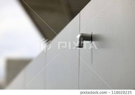 Roof PVC drain pipe or gutter, Rainwater downpipe. House drainage system on modern building. 118028235