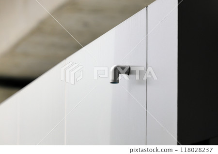Roof PVC drain pipe or gutter, Rainwater downpipe. House drainage system on modern building. Roof PVC drain pipe or gutter, Rainwater downpipe. House drainage system on modern building. 118028237