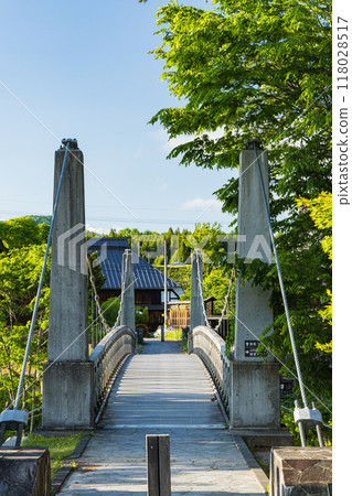 Oide Suspension Bridge over the Hime River that runs through Oide Park in Hakuba Village, Kitaazumi District, Nagano Prefecture, Japan 118028517