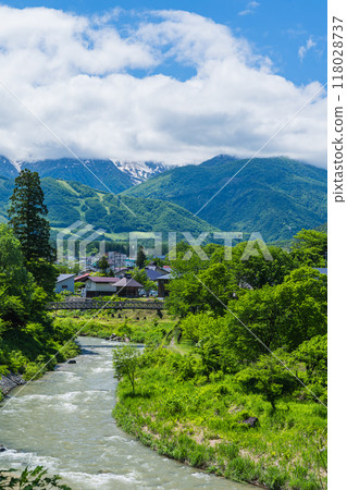 Oide Suspension Bridge, Himekawa River and Hakuba Sanzan as seen from the observation deck at Oide Park in Hakuba Village, Kitaazumi District, Nagano Prefecture, Japan Oide Suspension Bridge, Himekawa River and Hakuba Sanzan as seen from the observation deck at Oide Park in Hakuba Village, Kitaazumi District, Nagano Prefecture, Japan 118028737